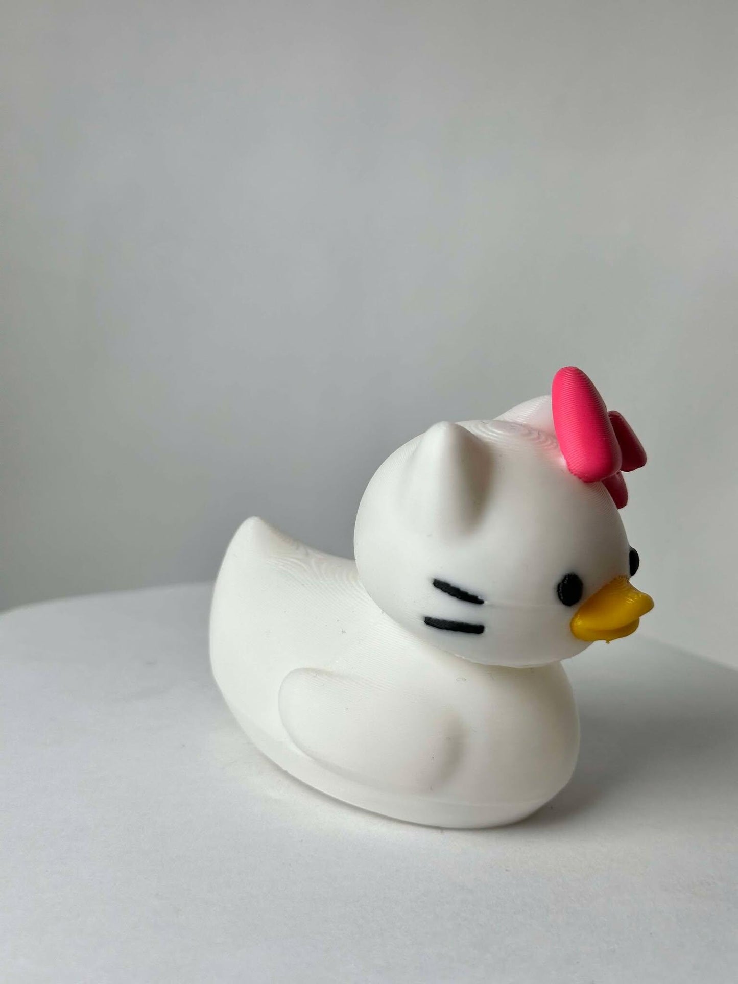 Hello Duck Inspired by Hello Kitty - Character Design with Pink Bow and Yellow Beak