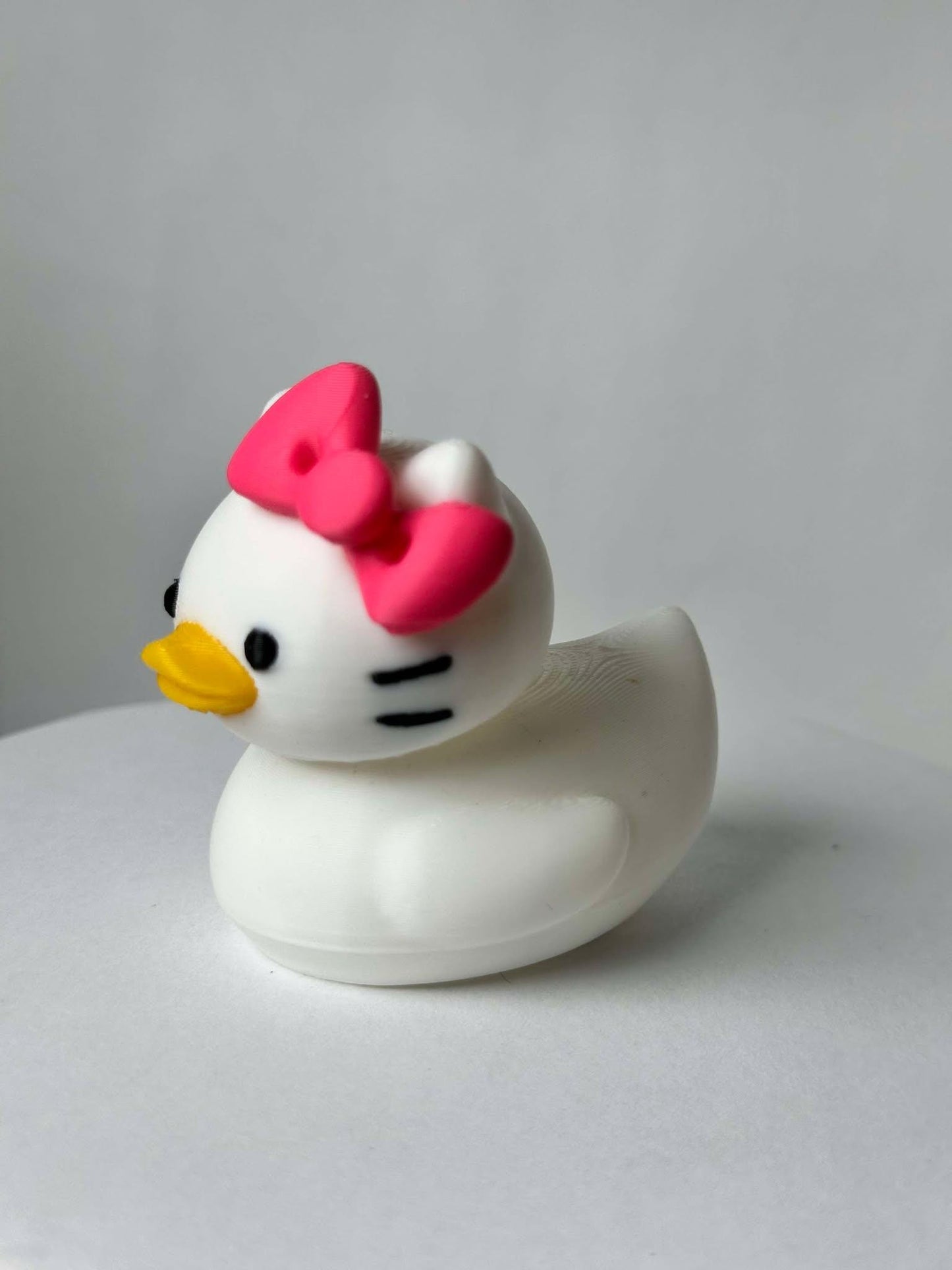 Hello Duck Inspired by Hello Kitty - Character Design with Pink Bow and Yellow Beak