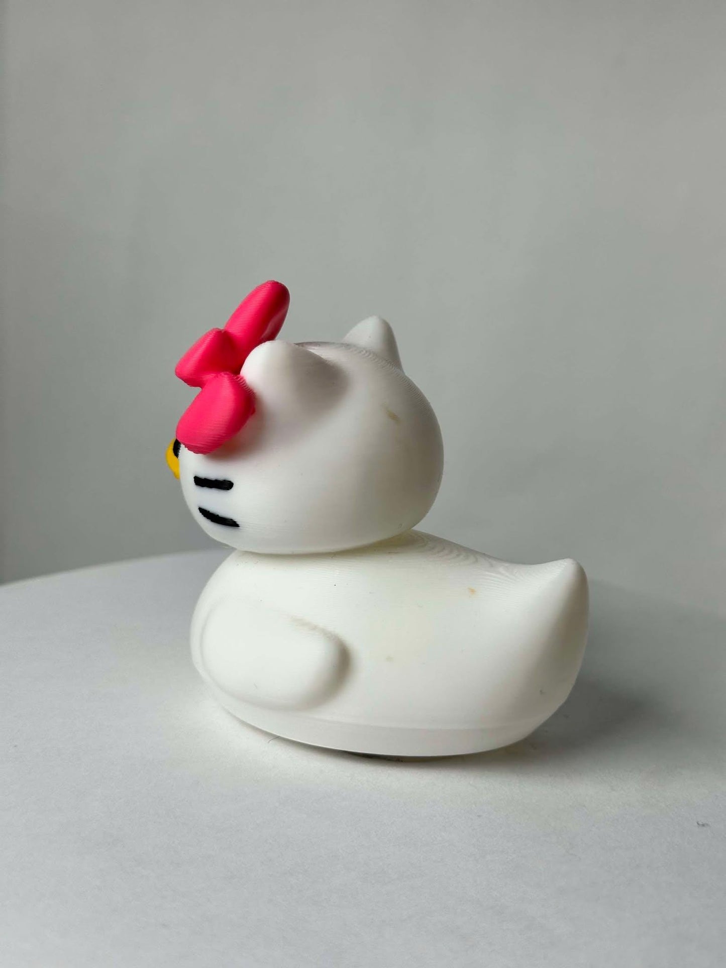 Hello Duck Inspired by Hello Kitty - Character Design with Pink Bow and Yellow Beak