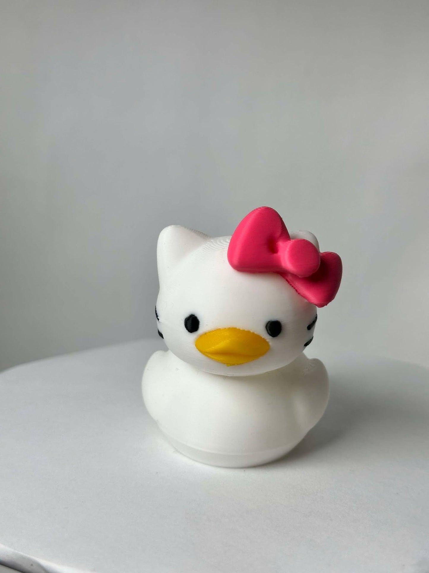 Hello Duck Inspired by Hello Kitty - Character Design with Pink Bow and Yellow Beak